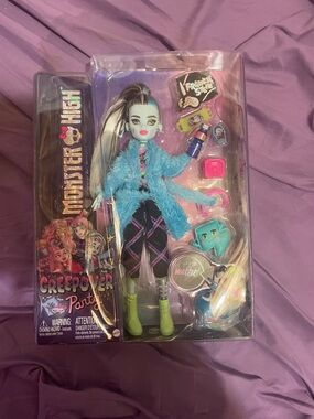 Monster High Doll with Turquoise Fuzzy Coat, Black Outfit & Lime Boots